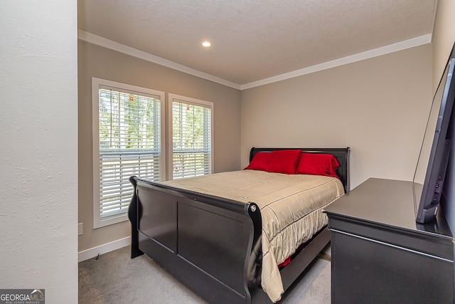 carpeted bedroom featuring a textured ceiling and ornamental molding