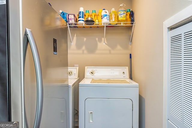 laundry room with washer and dryer