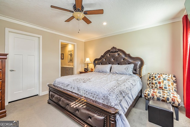 carpeted bedroom featuring ceiling fan, ornamental molding, a textured ceiling, and ensuite bath