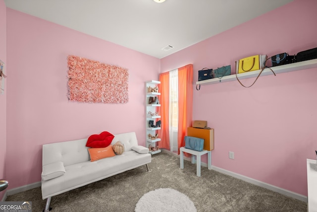 sitting room featuring carpet flooring