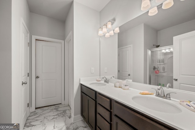 bathroom with vanity and a shower with shower door