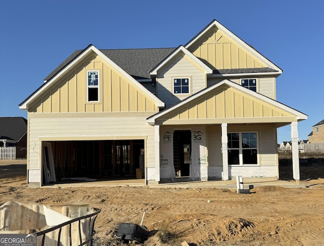 view of front of home with a garage and covered porch