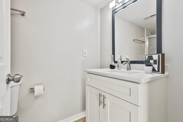 bathroom featuring vanity and wood-type flooring