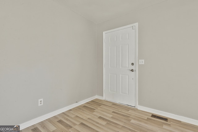 unfurnished room with light hardwood / wood-style floors