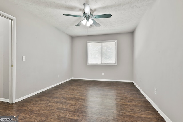 unfurnished room featuring a textured ceiling, ceiling fan, and dark hardwood / wood-style floors