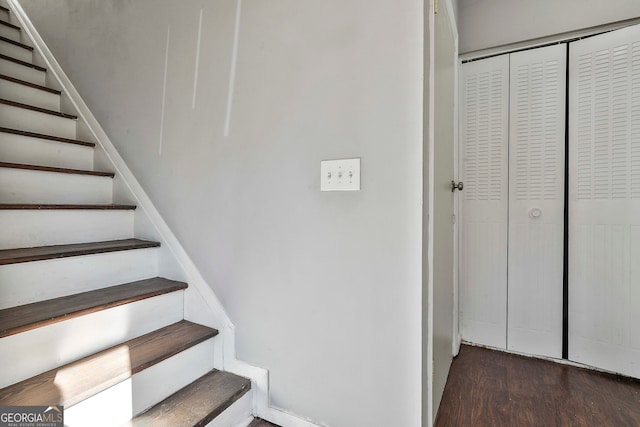 stairway featuring wood-type flooring