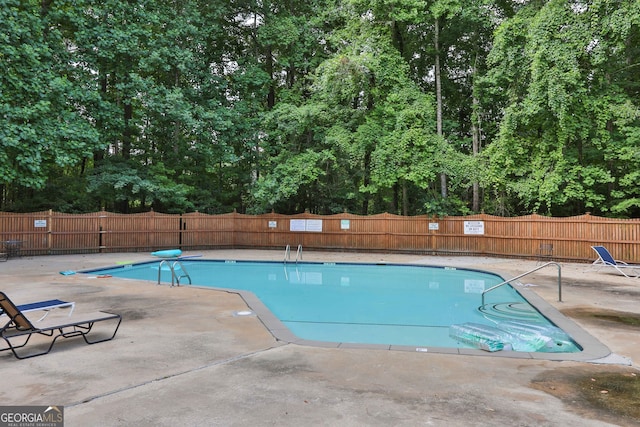 view of pool featuring a patio area