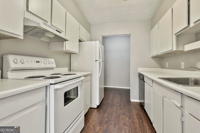 kitchen with a textured ceiling, white cabinetry, dark wood-type flooring, and white appliances