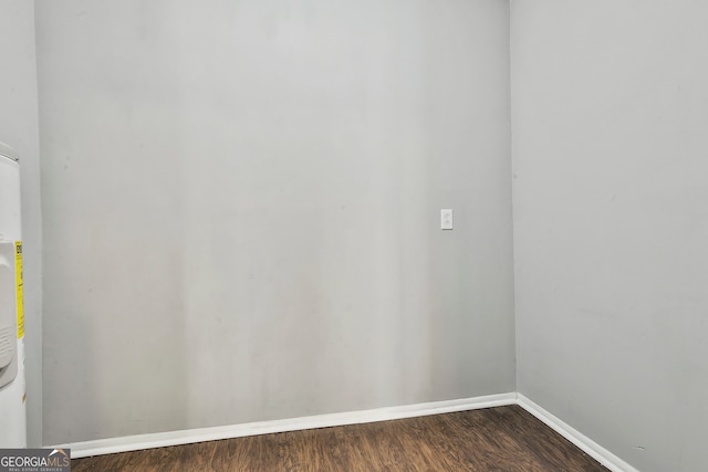 empty room featuring dark hardwood / wood-style floors