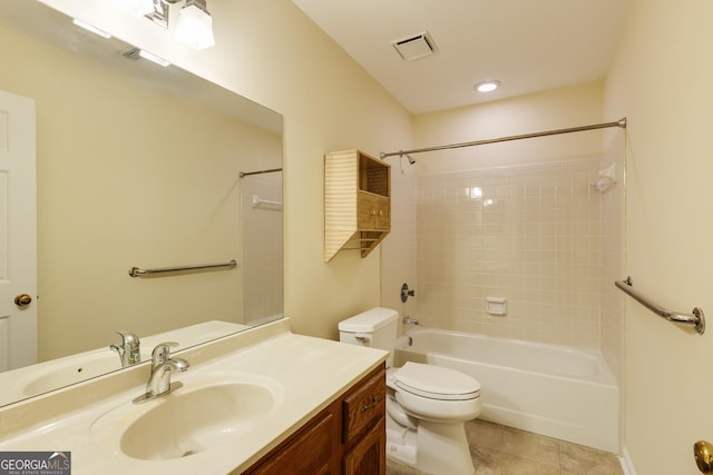 bathroom featuring visible vents, vanity, toilet, bathtub / shower combination, and tile patterned floors