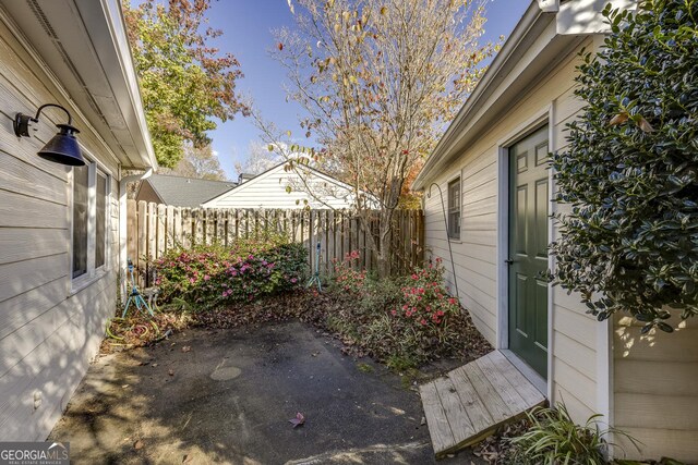 view of yard with fence and a patio area