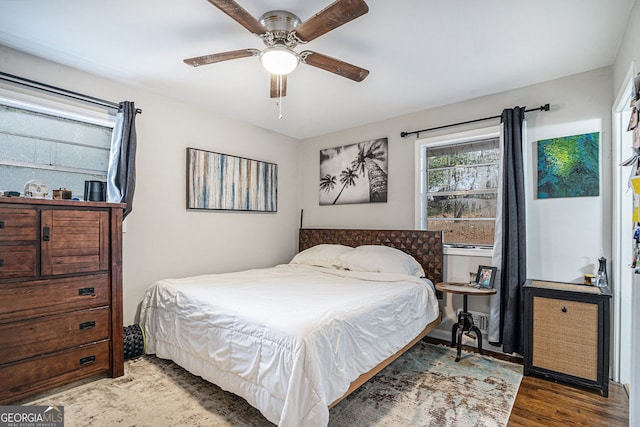 bedroom featuring hardwood / wood-style flooring and ceiling fan