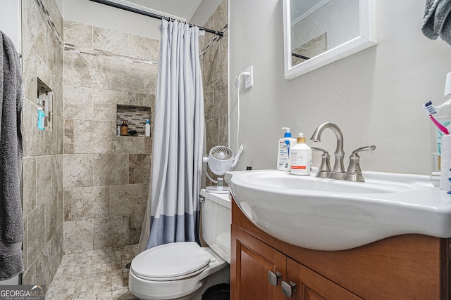 bathroom with vanity, toilet, and curtained shower