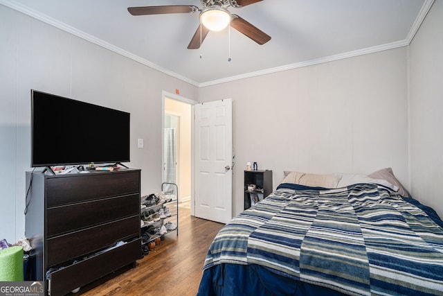 bedroom with ceiling fan, dark hardwood / wood-style flooring, and ornamental molding