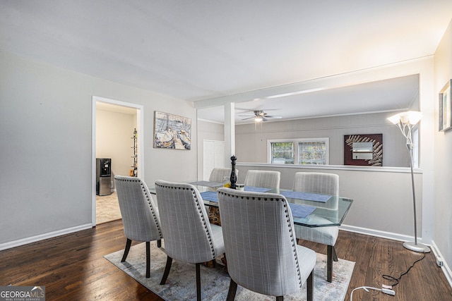 dining room with ceiling fan and dark hardwood / wood-style floors