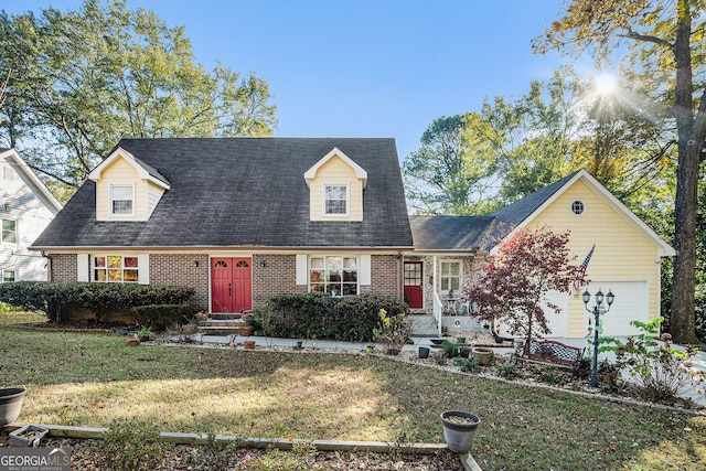 new england style home with a garage and a front lawn