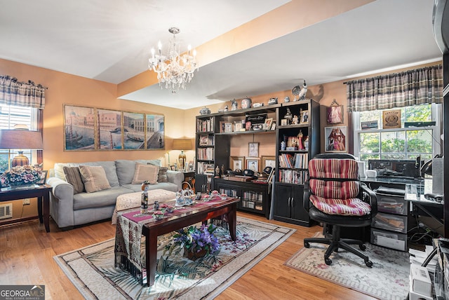 interior space featuring a chandelier and light hardwood / wood-style floors