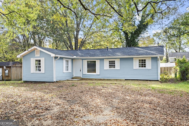 ranch-style house with a shed