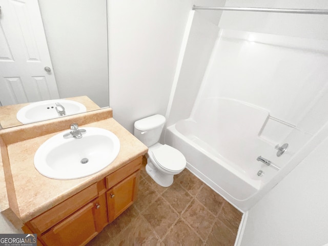 full bathroom featuring tile patterned floors, vanity, toilet, and bathing tub / shower combination