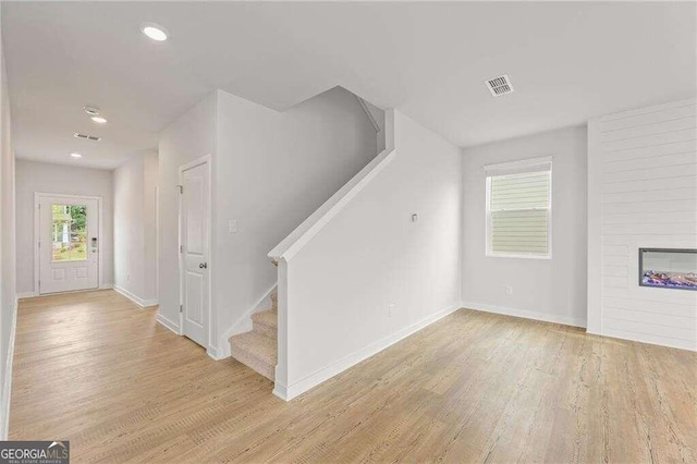 interior space featuring a fireplace and wood-type flooring