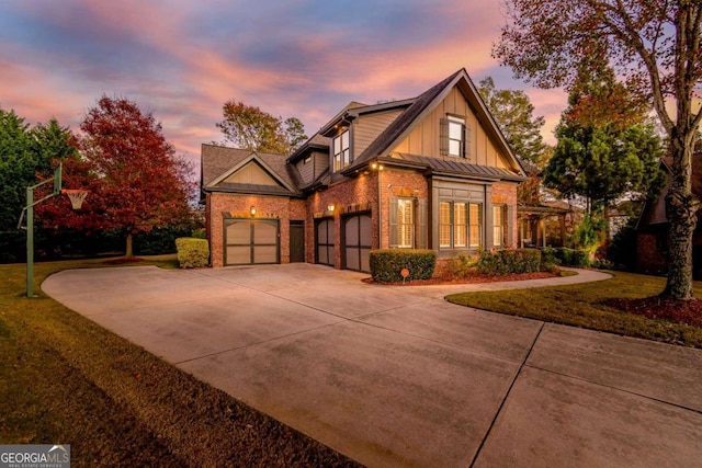 view of front of property with a lawn and a garage