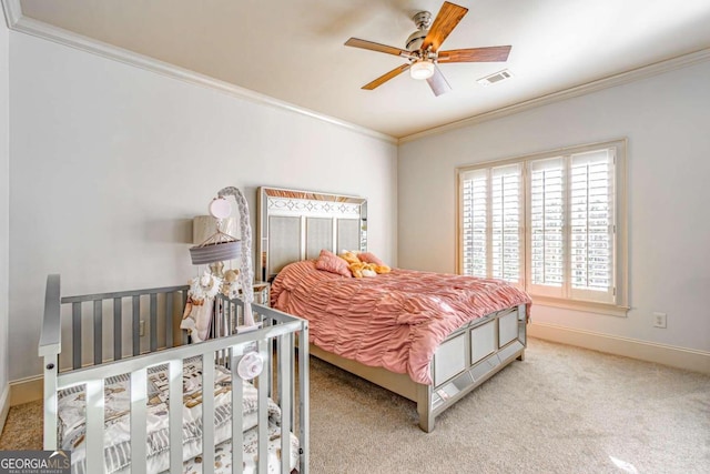 carpeted bedroom with ceiling fan and crown molding