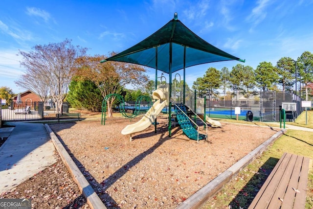 view of playground with tennis court