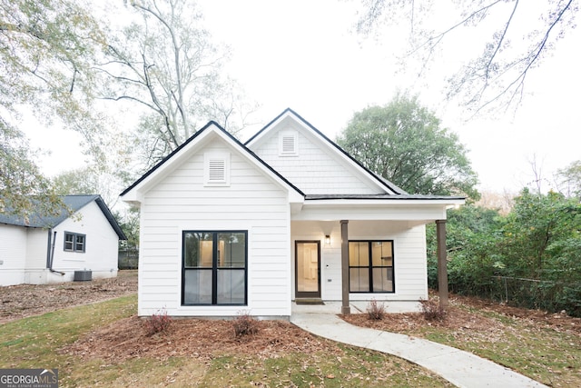 view of front of house featuring central AC unit and covered porch