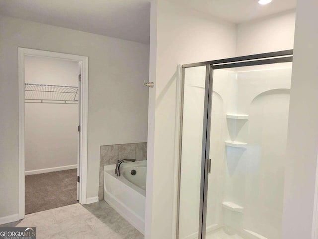 bathroom featuring plus walk in shower