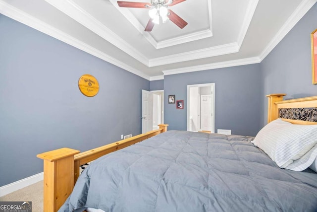 bedroom featuring carpet, a raised ceiling, ceiling fan, and crown molding