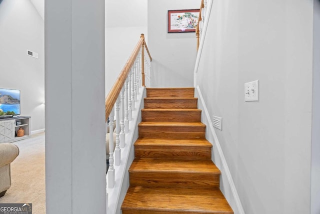 stairway with carpet floors