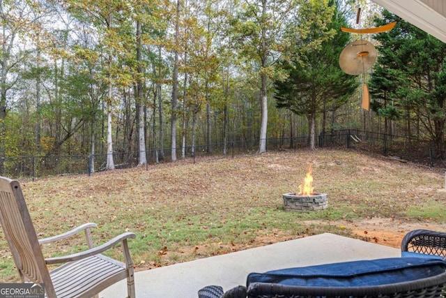 view of yard with a patio area and a fire pit