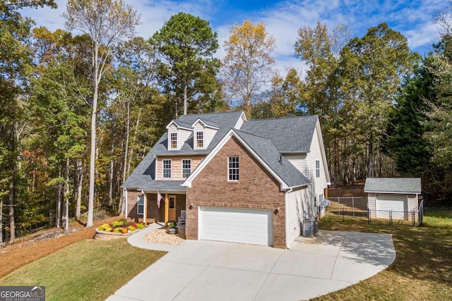 view of front of house with central AC, a front lawn, and a garage