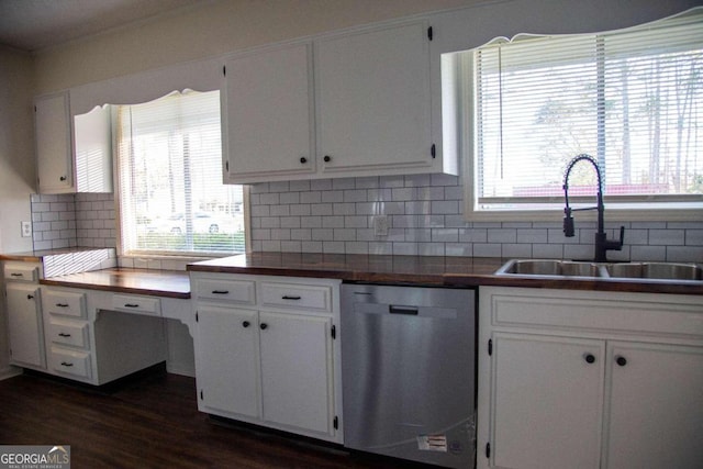 kitchen featuring white cabinets, dishwasher, sink, and a wealth of natural light