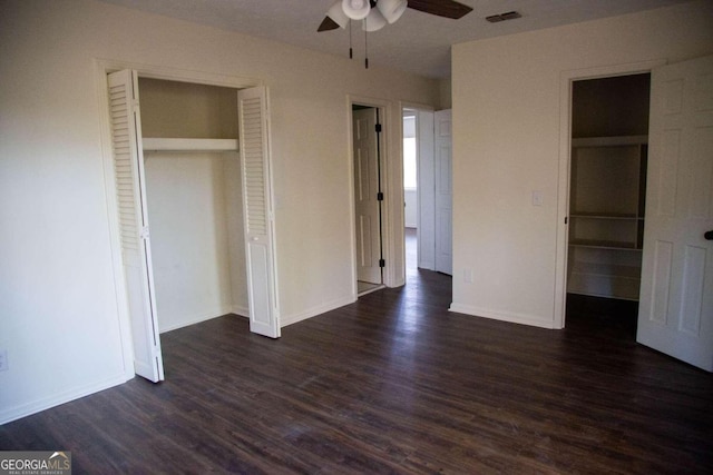 unfurnished bedroom featuring a closet, ceiling fan, and dark hardwood / wood-style flooring