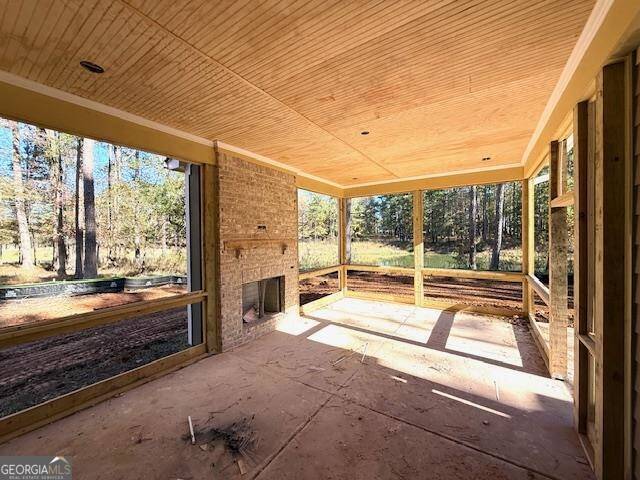 view of patio with an outdoor brick fireplace