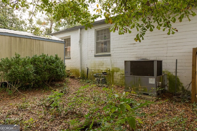 view of home's exterior with central AC unit