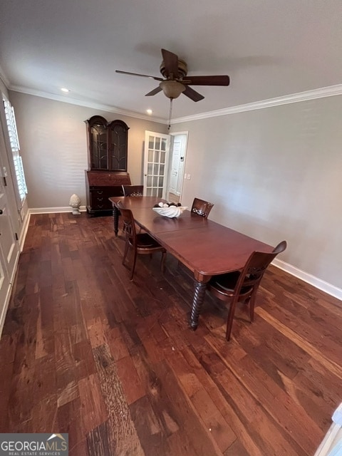 unfurnished dining area with dark hardwood / wood-style flooring, ceiling fan, and crown molding