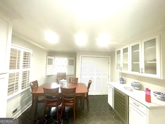 tiled dining area with crown molding