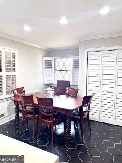 dining area with crown molding