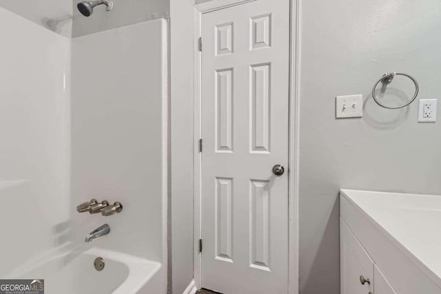 bathroom with vanity and bathing tub / shower combination