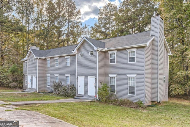 view of front of home featuring a front yard