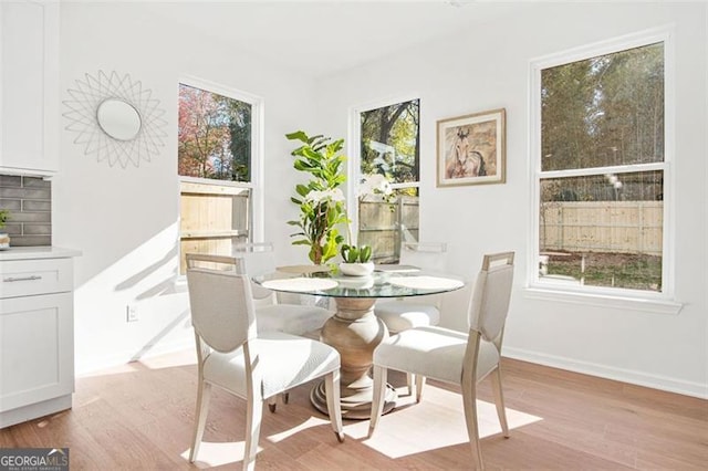 dining space featuring light hardwood / wood-style flooring