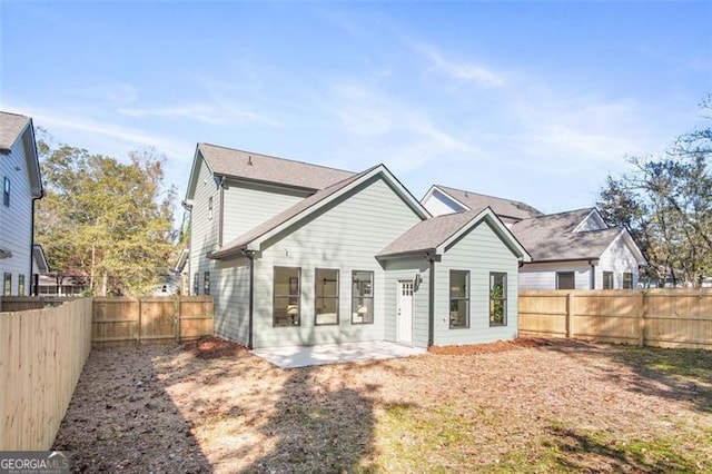 back of property with a patio