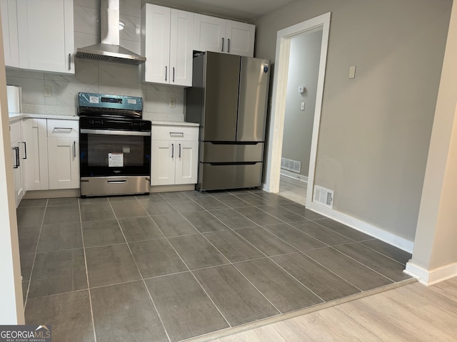 kitchen with white cabinetry, wall chimney exhaust hood, stainless steel appliances, dark hardwood / wood-style floors, and backsplash