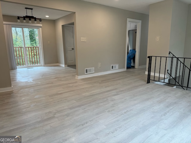 unfurnished room featuring light hardwood / wood-style floors