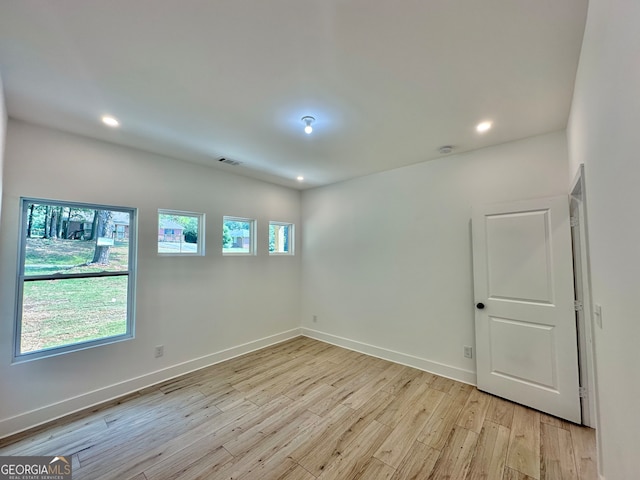 unfurnished room featuring light hardwood / wood-style floors