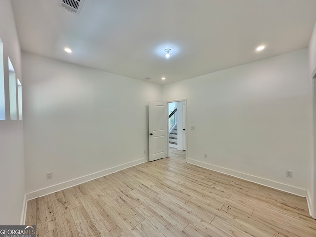 spare room featuring light wood-type flooring