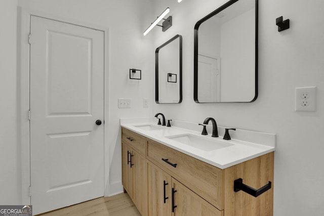 bathroom featuring hardwood / wood-style floors and vanity