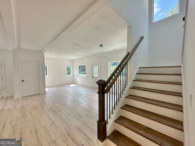 staircase featuring hardwood / wood-style flooring